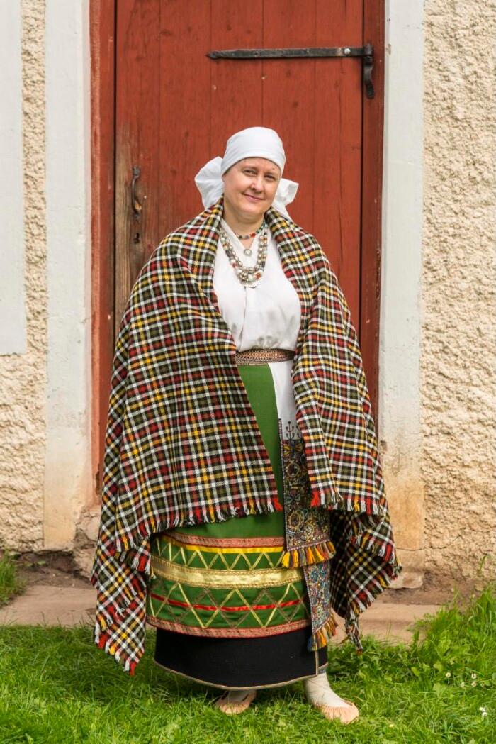 Amy Koitmäe wearing Halliste parish national costume, made by herself